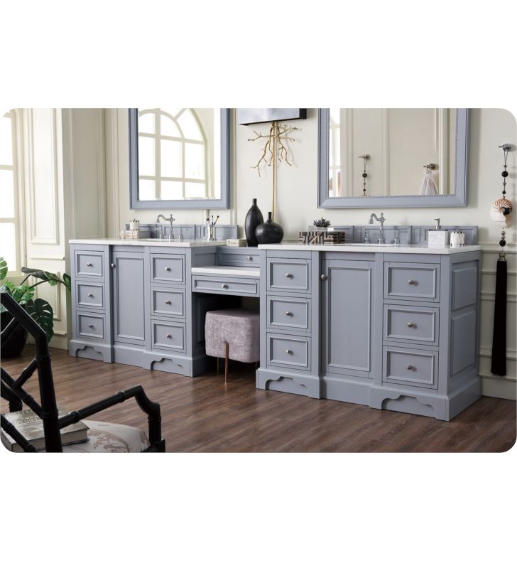 a bathroom vanity with two sinks and mirrors