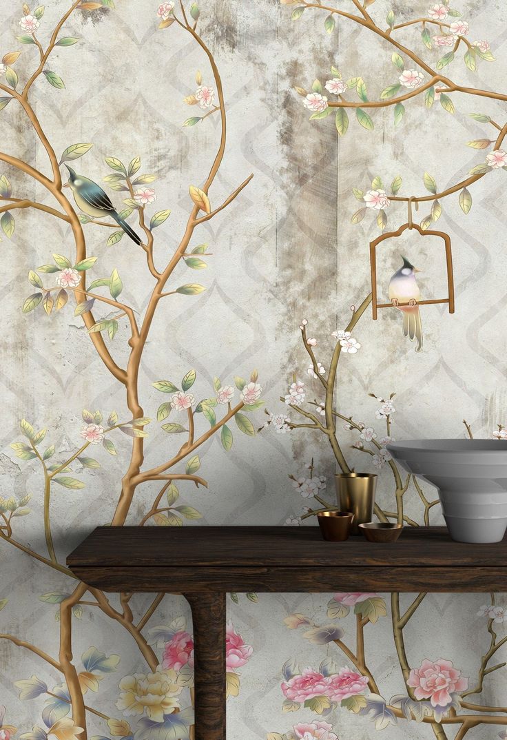 the wallpaper is decorated with flowers and birds on it, along with a birdcage