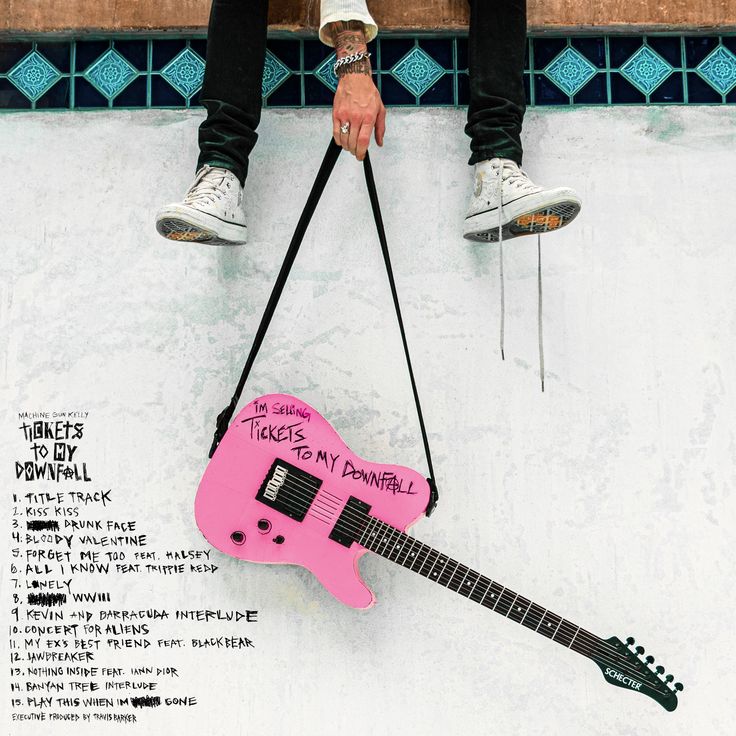 a person sitting on top of a skateboard with a pink guitar attached to it