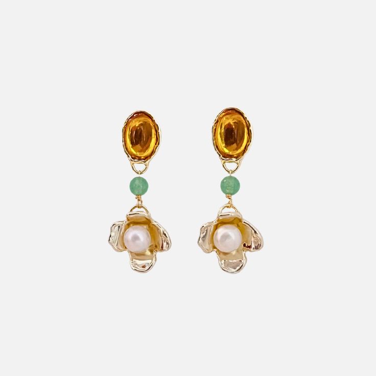 With playful colors, Jade, and hand-carved flowers, these Amber Earrings by Anita Berisha are lightweight and can be worn day to night. Materials: Cultured Freshwater Pearls, Glass Stones, Jade Beads, 12k Gold Fill, High Polished Brass with 14k Gold Plate. Measures: 2.25" Handmade in New York, USA Elegant Yellow Dangle Flower Earrings, Elegant Gold Flower-shaped Beaded Earrings, Elegant Gold Flower Beaded Earrings, Elegant Orange Flower Earrings, Elegant Yellow Flower Shaped Earrings, Elegant Yellow Flower-shaped Earrings, Gold Flower-shaped Beaded Earrings, Yellow Jewelry With 3d Flower Details, Yellow Flower Drop Earrings For Wedding