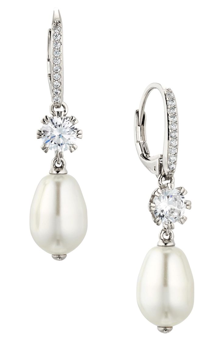 Lustrous imitation-pearl drops dangle from these cubic zirconia-illuminated earrings that add an elegant flourish to your special-occasion look. 1 1/4" drop; 1/4" width Lever-back closure Imitation pearl/rhodium plate/cubic zirconia Imported Silver Pearl Earrings, Pearl Earring, Wedding Look, Pearl Drop Earrings, Silver Pearls, Wedding Looks, Pearl Drop, Wedding Earrings, Rhodium Plated