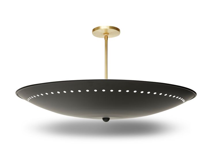 a black and gold hanging light fixture on a white background with dim lighting from the ceiling