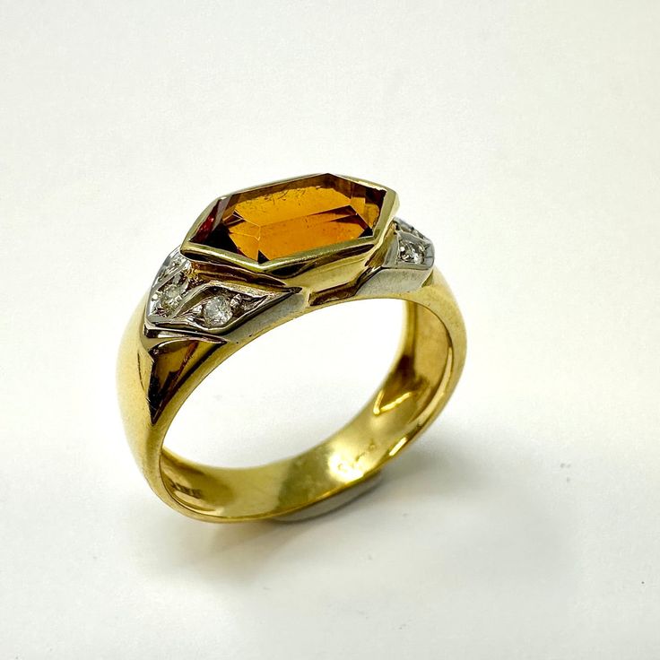 18K Gold Ring with Citrine and Diamonds Designer = Jewelry Size = 5.5 Material = 18K Gold Gemstone = Citrine Condition = Excellent Class = Premier Location: Wilmette Item Number: 11405-1279 Item ID: 283204 Category: Ring Modern Topaz Ring With Gemstone Accents For Formal Occasions, Elegant Orange Rings With Gemstone Accents, Formal Yellow Topaz Ring With Diamond Accents, Formal Emerald Cut Multi-stone Topaz Ring, Gold Topaz Multi-stone Ring, Elegant Multi-stone Citrine Topaz Ring, Elegant Multi-stone Topaz And Citrine Ring, Gold Rings With Topaz Gemstone Accents, Yellow Rings With Gemstone Accents For Formal Occasions