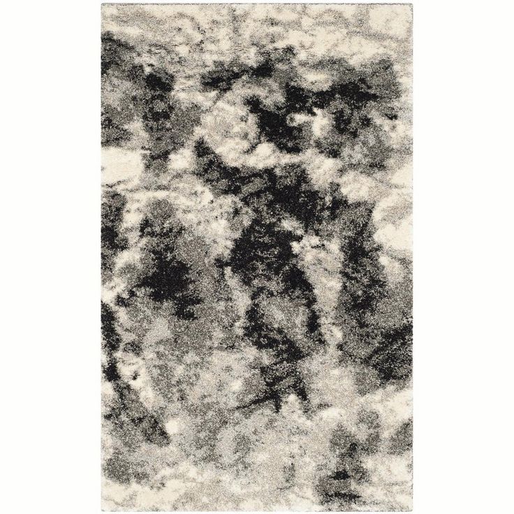 a black and white rug with clouds on it