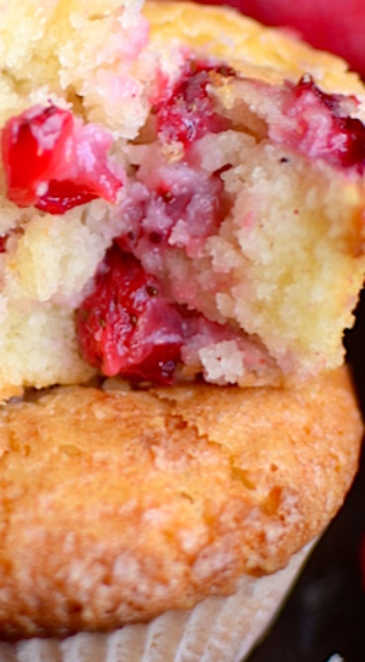 a muffin with strawberries is cut in half