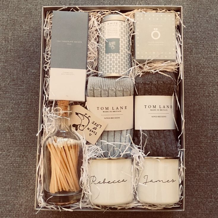 an open box with matches, socks and candles