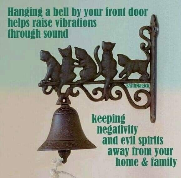 there is a bell with cats on it and the caption reads hanging a bell by your front door helps raise vibraions through sound