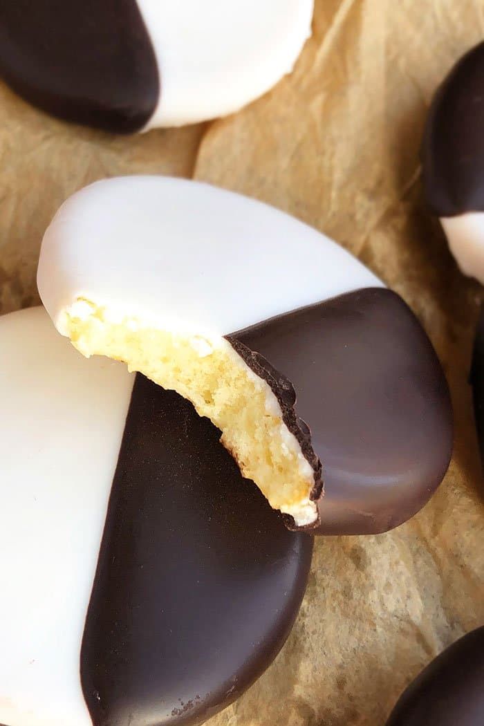 chocolate covered cookies with white and black frosting