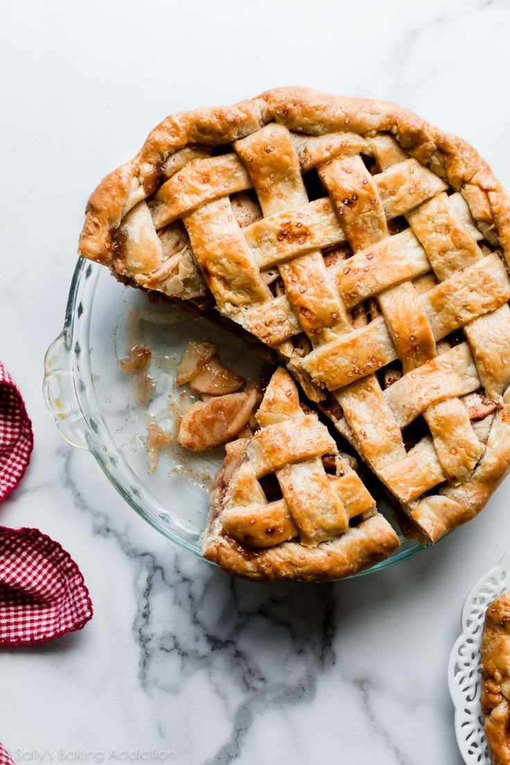 two pies cut in half on top of a table