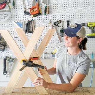 a woman working on a piece of wood