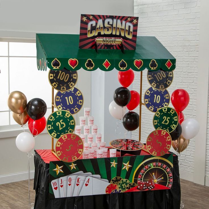 a casino themed party with balloons and streamers