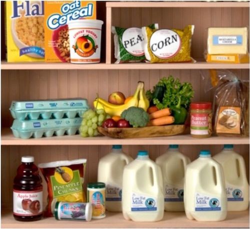 the shelves are filled with milk, eggs, fruit and other foodstuffs on them