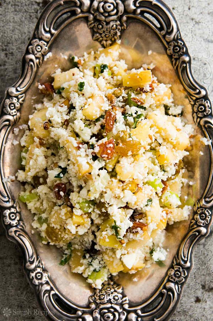 a bowl filled with food sitting on top of a table