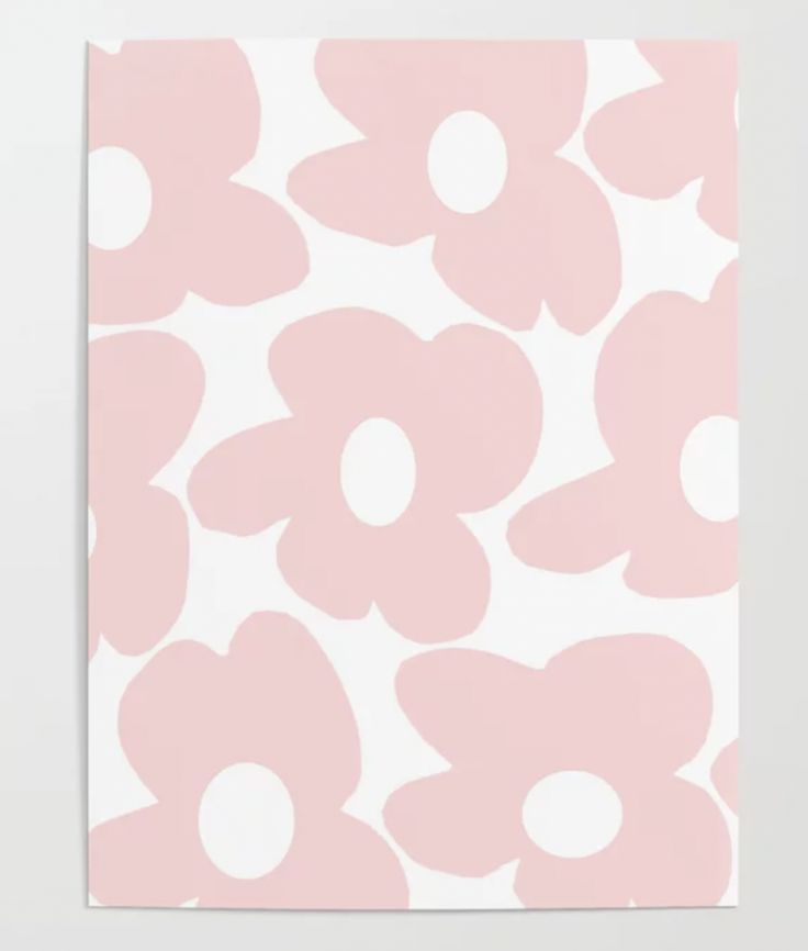 a pink and white flower pattern on a wall