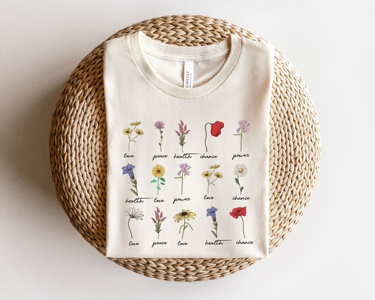 "Wildflower Shirt, Botanical Shirt, Womens Wildflowers Graphic Tshirt, Boho Botanical Chart T-shirt, Botany Floral Gift, Nature Lover Shirt ⭐Please Check All Photos For Details.   🐞Choose Your T-Shirt Size From The Drop-Down Lists Next To The item Picture   ⭐Choose Of Your T-Shirt Color From The 2nd Picture   🐞Use \"Add message to Seller\" link On The Checkout Page To Send me the Following important Details For Your Order's Customization.   ⭐Shipping Time Varies by location (we are located in Sugar Land, Texas) please consider that our turn around time is 1 to 3 business days. ⭐Which brand do you use for t-shirts? We use Gildan Soft Style, Bella Canvas Unisex, Rustic United,  Hanes, District and Next Level when we have a shortage of stocks for certain colors and sizes. Our printing metho Day To Day Outfits, Sugar Land Texas, Wildflower Shirt, Botanical Shirt, Sugar Land, Checkout Page, Botanical Illustrations, Floral Gifts, Soft Style