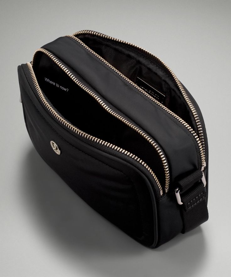 a black bag with gold zippers on the inside