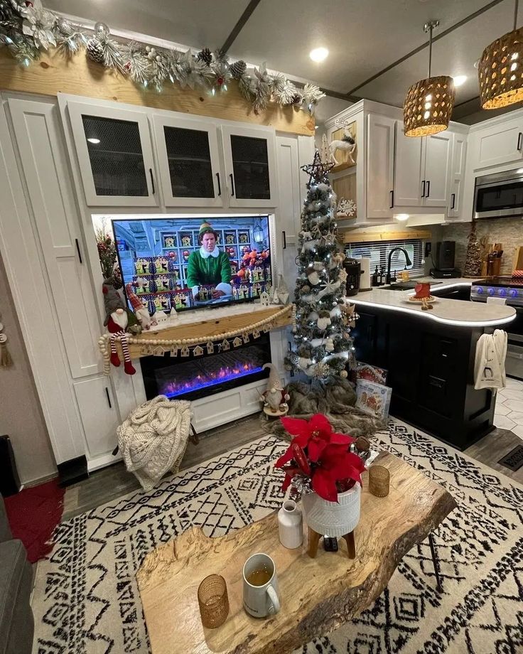 a living room with a christmas tree in the corner and a tv on above it