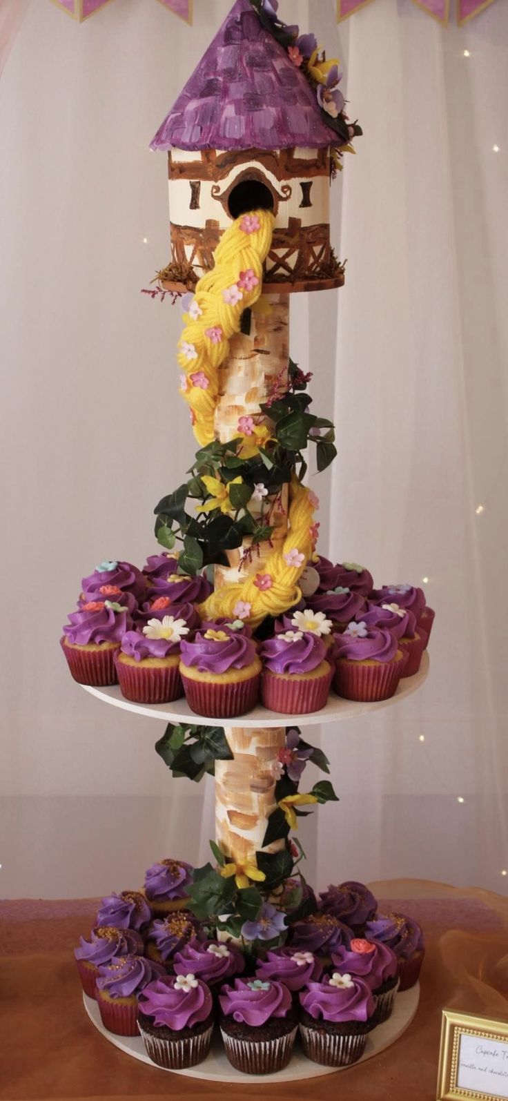 there is a tower with cupcakes on it