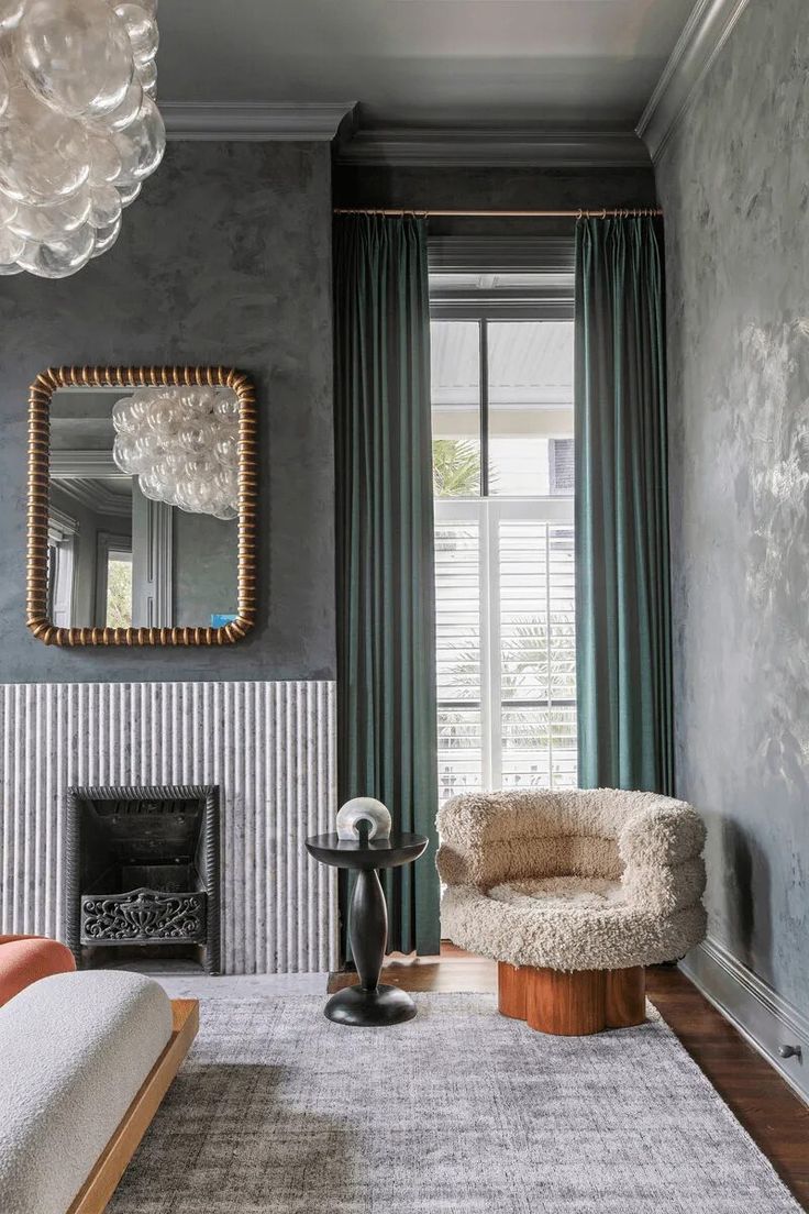 a living room with grey walls and furniture