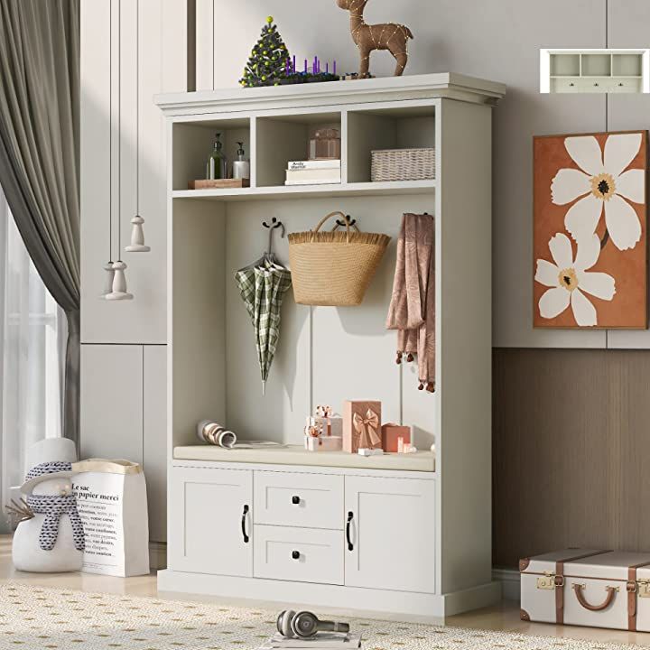 a living room with a white bookcase filled with items and decor on top of it