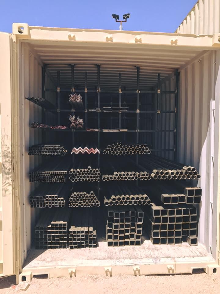 the cargo container is filled with many different types of steel bars and other metal items