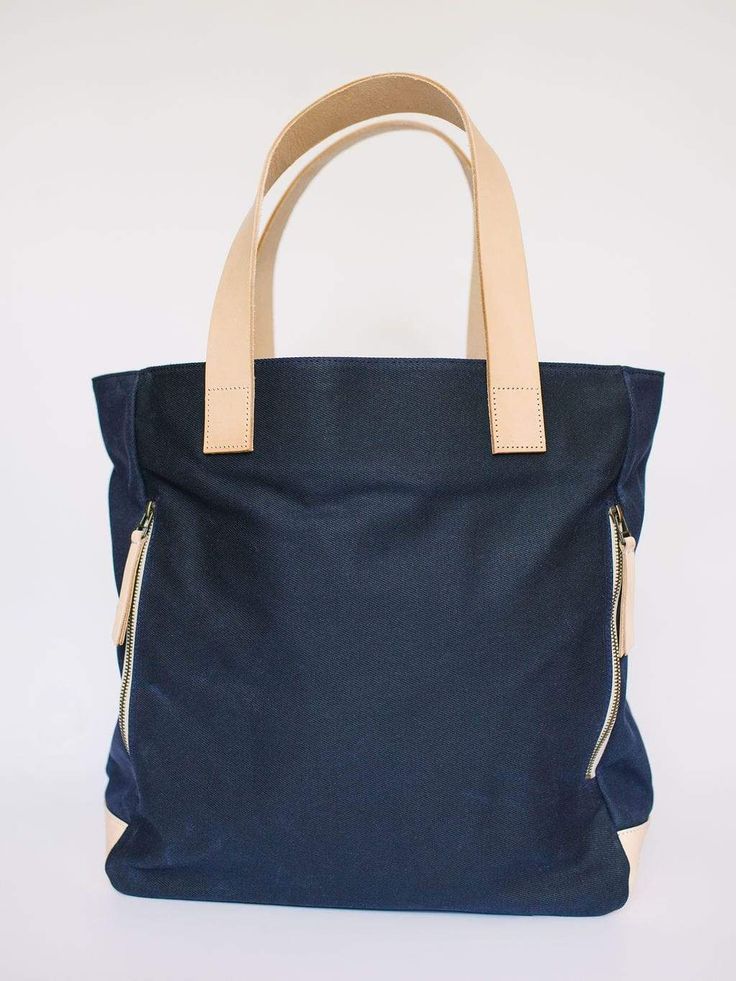 Navy Waxed Canvas Tote Bag by Notebooks & Honey – notebooks & honey Cotton Travel Bags With Twill Lining, On-the-go Weekender Tote Bag With Canvas Lining, On-the-go Weekender Tote With Canvas Lining, Waxed Canvas Bag With Canvas Lining For On-the-go, Coated Canvas Bag With Canvas Lining For On-the-go, Navy Cotton Canvas Bag For Everyday, Waxed Canvas Bag For On-the-go, Navy Tote Shoulder Bag For Everyday, Navy Cotton Travel Bag