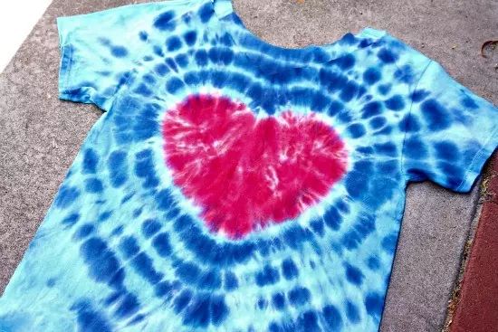 a tie dyed shirt with a heart on it