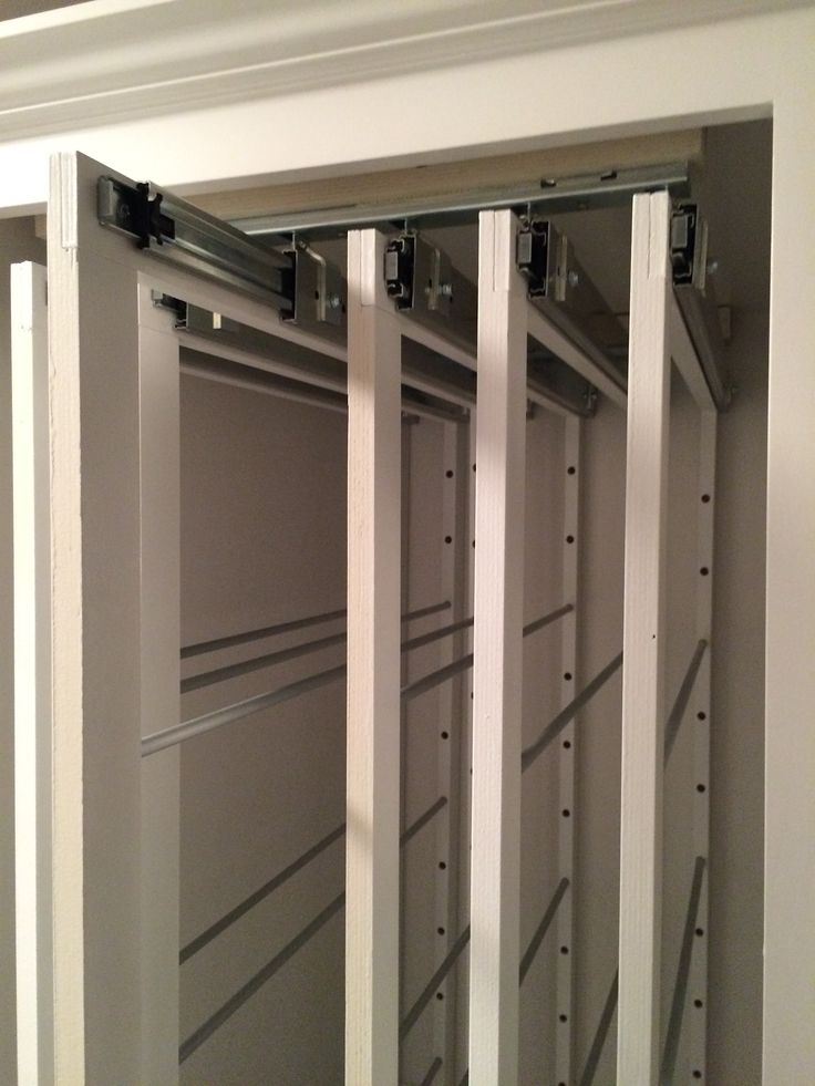 the inside of a closet with metal bars