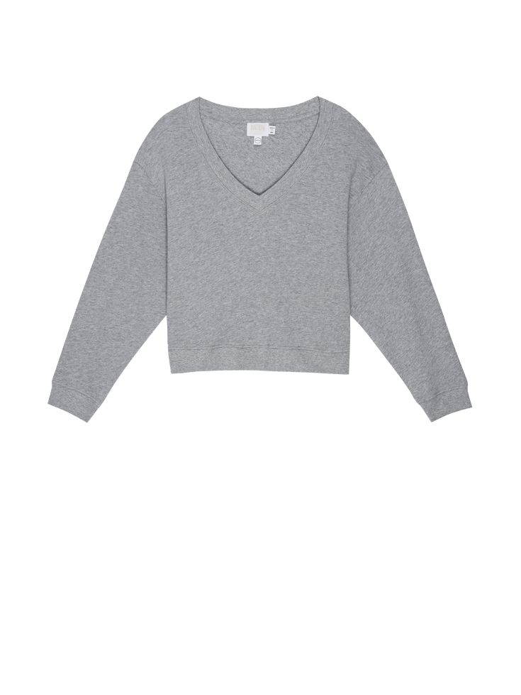 Off-shoulder, on shoulder, whatever. We can't tell you what to do. But we can tell you this varsity-inspired V neck is as effortless and comfortable as it is chic. (This one comes in Heather Grey.) | Women's Wyatt Sweatshirt in Heather Grey | Ethical Essentials Classic Oversized V-neck Top, Everyday Relaxed Fit V-neck Sweater, Trendy V-neck Sweatshirt In Relaxed Fit, Oversized Sporty V-neck Top, Sporty Tops For Weekend Fall Season, Sporty Oversized V-neck Top, Sporty Tops For Fall Weekend, Sporty Top For Weekend Fall Season, V-neck Loungewear Top With Ribbed Cuffs