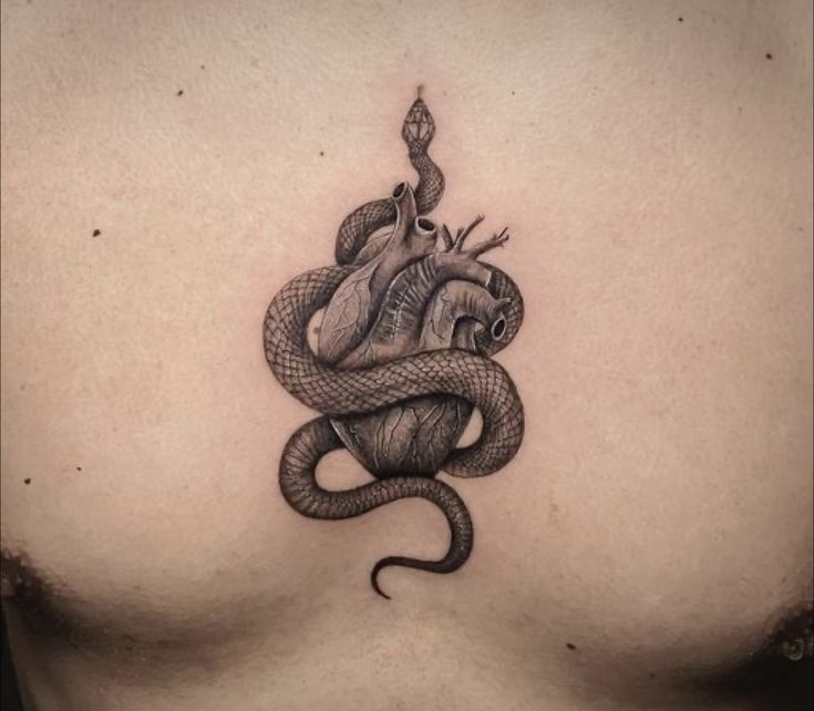 a man with a snake tattoo on his chest