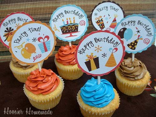 cupcakes with happy birthday signs on them