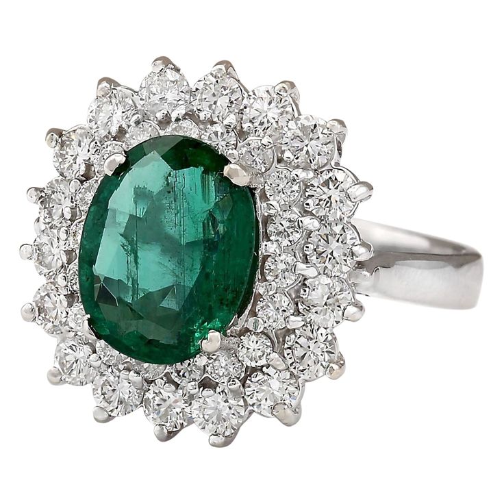 Stamped: 14K White Gold Total Ring Weight: 6.5 Grams Ring Length: N/ARing Width: N/A Gemstone Weight: Total Natural Emerald Weight is 2.58 Carat (Measures: 10.40x8.20 mm) Color: Green Diamond Weight: Total Natural Diamond Weight is 1.40 Carat Quantity: 36 Color: F-G, Clarity: VS2-SI1 Face Measures: 17.90x16.80 mm Sku: [703828W] Oval Emerald Gemstones With Halo Setting, Luxury Cluster Diamond Ring With Gemstone, Formal Gia Certified Emerald Gemstones, Exquisite Oval Platinum Gemstones, Gia Certified Elegant Emerald Gemstones, Elegant Gia Certified Emerald Gemstones, Formal Emerald Gemstones With Prong Setting, Elegant Cluster Sapphire Ring, Gia Certified, Elegant Gia Certified Cluster Sapphire Ring