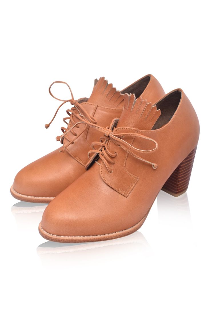 These simple yet super stylish handmade leather oxford booties combine masculine & feminine trends. Designed in a simple lace-up style and upgraded with fringe detailing and wooden heels Lyon oxfords are timeless classics that will declare their elegant style season after season. Style them with your pants, tailoring, and short dresses and you will love wearing them. 100% genuine leather Smooth leather lining and insole with embossed logo Lightly padded footbed Leather and rubber outsole Leather Oxford Booties, Wooden Heels, Masculine Feminine, Dark Tan, Wooden Heel, Chic Boutique, Embossed Logo, Ethical Fashion, Handmade Leather