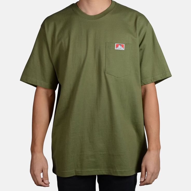 Crafted from a heavyweight poly-cotton blend, this short sleeve pocket tee is designed to withstand even the most challenging conditions. The oversized fit provides ample room for layering and unrestricted movement. With its durable construction and functional design, this long sleeve tee is the perfect choice for stay Casual Green T-shirt For Everyday, Green Urban Cotton T-shirt, Urban Green Cotton T-shirt, Green Short Sleeve Streetwear Tops, Urban Style Green Cotton T-shirt, Green Casual T-shirt For Everyday, Green Short Sleeve Tops For Streetwear, Green Cotton Tops For Streetwear, Urban Green Crew Neck Top