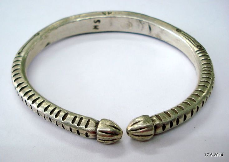 "vintage antique tribal old silver armlet bracelet from rajasthan india. Made of solid silver and then engraved design on it, Worn by tribal people of Rajasthan. great handmade design, good for jewelry collection. Inner diameter side to side - 7.4 cm (2.9\") Inner circumference - 22.4 cm (8.8\") weight - 120 grams material - Good silver and original old worn piece." Traditional Sterling Silver Bracelet For Ceremonial Occasions, Traditional Ceremonial Sterling Silver Bracelet, Traditional Adjustable Oxidized Sterling Silver Bracelet, Traditional Silver Carved Cuff Bracelet, Traditional Sterling Silver Adjustable Bracelet For Ceremonial Wear, Traditional Adjustable Sterling Silver Bracelet With Oxidized Finish, Traditional Silver Carved Bangle, Traditional Engraved Sterling Silver Bracelet For Ceremonial Use, Traditional Adjustable Engraved Bangle