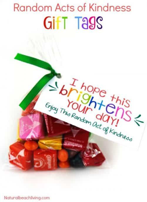 a bag filled with candy and a sign that says random acts of kindness gift tags