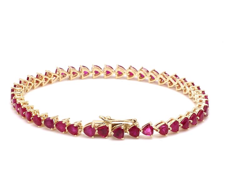 Ruby trillion cut tennis bracelet in 14k 18k gold, Natural 4mm 7-8ct ruby tennis bracelet chain gold, July birthstone red ruby bracelet gold STONE DETAILS : ✦ Gemstone: Ruby ✦ Gemstone Type : Natural ✦ Gemstone Size : 4mm ✦ Gemstone Shape : Trillion cut ✦ Number of gemstones : 43 ✦ Gemstone Weight : 7-8 carats ✦ Gemstone Grade : AAAA METAL DETAILS : ✦ Metal : 14K/18K Gold ✦ Metal Color : Yellow / White / Rose Gold ✦ Setting : Prong Setting ✦ Ring Box : Yes SHIPPING DETAILS : ✦ Shipped via ; USPS Valentine's Day Gift Tennis Bracelet, Ruby Gemstone Tennis Bracelet In Fine Jewelry Style, Ruby Tennis Bracelet In Yellow Gold For Anniversary, Ruby Gemstone Tennis Bracelet, Anniversary Ruby Tennis Bracelet In Yellow Gold, Classic Gold Ruby Tennis Bracelet, Gold Ruby Tennis Bracelet Gift, Yellow Gold Ruby Tennis Bracelet For Anniversary, Gold Ruby Tennis Bracelet As A Gift