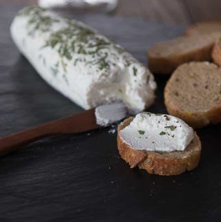 some bread and cheese are on a table