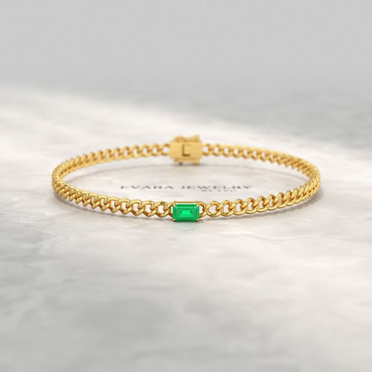 Elevate your style with this stunning Natural Emerald Cuban Chain Link Statement Bracelet in 14K Yellow Gold. Perfect for graduation gifts or personalized jewelry, this Cuban curb chain bracelet features a vibrant emerald centerpiece. Luxurious and eye-catching, this 14K yellow gold chain bracelet is sure to make a statement. 𝐅𝐞𝐚𝐭𝐮𝐫𝐞𝐬: * 𝐌𝐚𝐝𝐞 𝐭𝐨 𝐎𝐫𝐝𝐞𝐫 * 𝐌𝐞𝐭𝐚𝐥: 𝟏𝟎𝐊 𝐆𝐨𝐥𝐝 | 𝟏𝟒𝐊 𝐆𝐨𝐥𝐝 | 𝟏𝟖𝐊 𝐆𝐨𝐥𝐝 | 𝟗𝟓𝟎 𝐏𝐥𝐚𝐭𝐢𝐧𝐮𝐦 * 𝐁𝐚𝐧𝐝 𝐂𝐨𝐥𝐨𝐫𝐬: Rose Gold, Elegant Curb Chain Bracelets For Anniversary, Elegant Curb Chain Bracelet For Anniversary, Elegant Gold Bracelet With Curb Chain For Anniversary, Elegant Gold Curb Chain Bracelet For Anniversary, Fine Jewelry Diamond Bracelet With Solid Link For Gift, Gift Diamond Bracelet With Curb Chain, Elegant Cuban Link Bracelet As Gift, Fine Jewelry Curb Chain Bracelet As Gift, Fine Jewelry Curb Chain Bracelet Gift