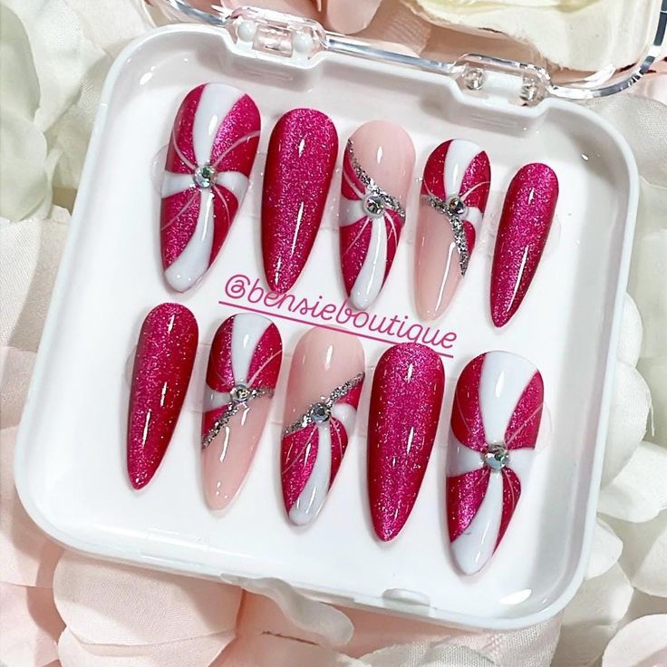 Featured is the Almond - Long Sculpted.  Standard Set *Includes 10 nails. Please keep the following in mind:  *If your nail bed is in between sizes, it is recommended that you size up.  Set Sizes are not universal and differ with each nail manufacturer AND artist. For the best experience, it is suggested that you either purchase a Full Set (when available) or a Sizing Kit to determine what your ideal sizes are beforehand. Sculpted nails are best suited for people whose nail beds are more curved Cateye Christmas Nail Designs, Christmas Nails Extra, Pink Peppermint Nails, Peppermint Swirl Nails, Hot Pink Christmas Nails, Bling Christmas Nails, Extra Christmas Nails, Nails Cateye, Peppermint Nails