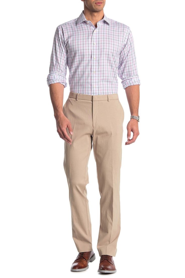 Fit: this style fits true to size. Spring Business Elastane Pants, Spring Business Pants In Elastane, Spring Business Pants Made Of Elastane, Spring Slim Fit Flat Front Chinos, Fitted Chinos For Spring Business Wear, Fitted Cotton Work Pants With Flat Front, Spring Stretch Business Casual Bottoms, Spring Slim Fit Elastane Dress Pants, Tailored Spring Pants With 5-inch Inseam