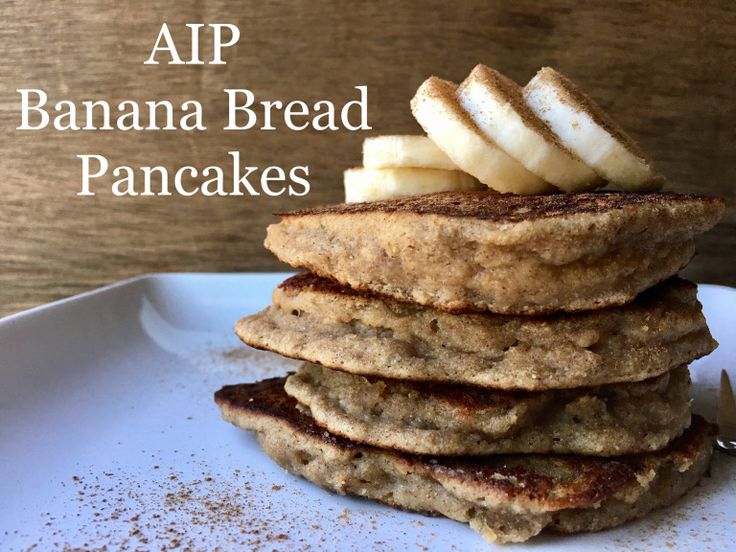 a stack of pancakes topped with banana slices