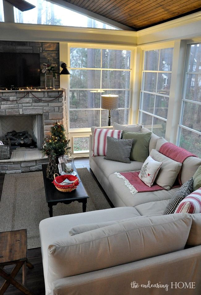 a living room filled with furniture and a fire place