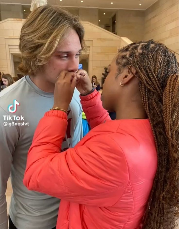 a man and woman standing next to each other