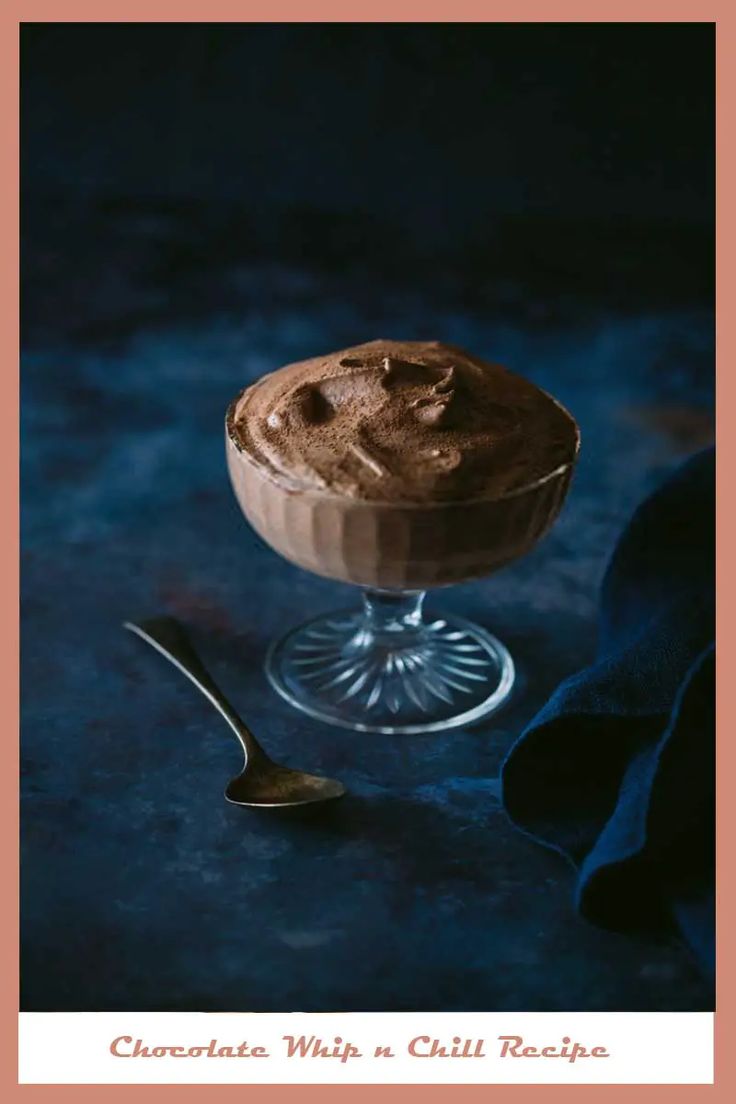 chocolate whip n chilli recipe in a glass bowl with a spoon next to it