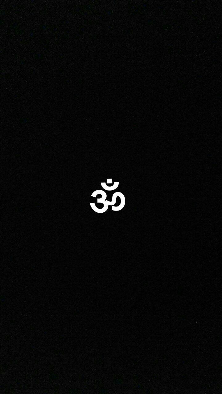 a black background with an om symbol in the middle and two white letters on it