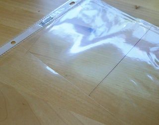 a piece of clear plastic sitting on top of a wooden floor