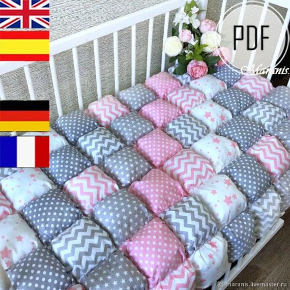 the baby crib bedding is made with pink, grey and white chevrons