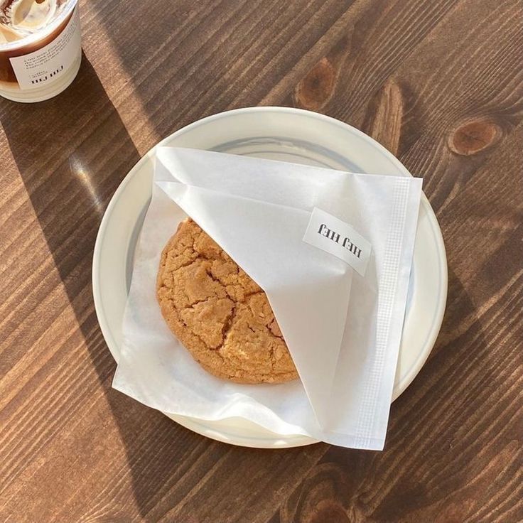 a cookie sitting on top of a white plate