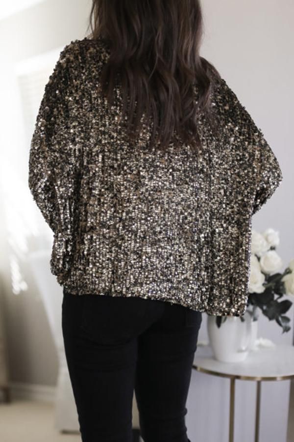 Gold Holiday Glow Sequin V Neck Blouse Glamorous V-neck Winter Top, Glamorous Metallic Tops For Fall, Metallic Long Sleeve Top With Sequins, Glamorous Long Sleeve Metallic Blouse, Glamorous Metallic Long Sleeve Blouse, Metallic Long Sleeve Glamorous Blouse, Metallic Long Sleeve Tops For Fall, Glamorous Gold Long Sleeve Top, Chic Long Sleeve Metallic Blouse